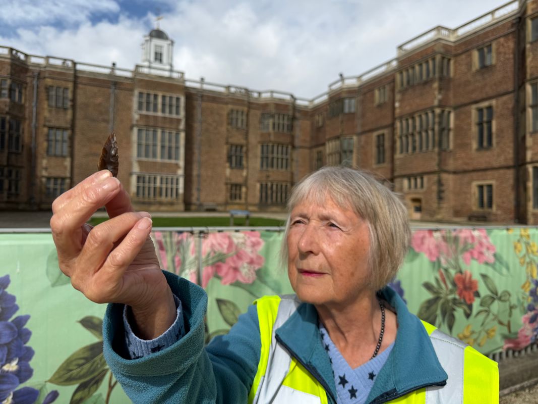 Carole Bloom holding an arrowhead which may be up to 5,000 years old