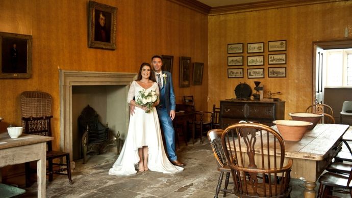 A wedding couple in a room at Temple Newsam