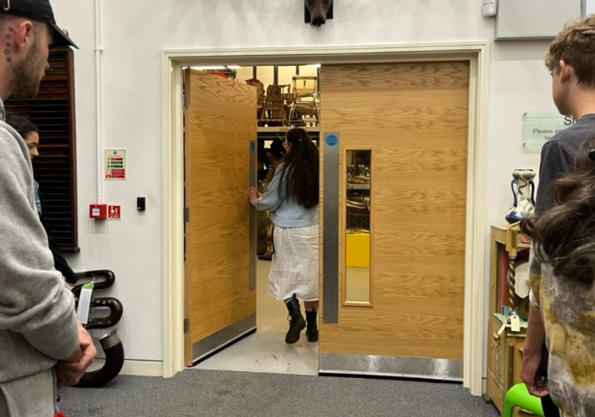 Visitors going through the collection store double doors