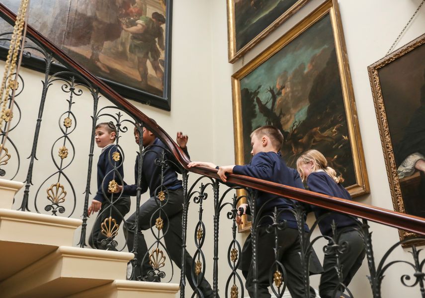 children walking up the stairs in Temple Newsam