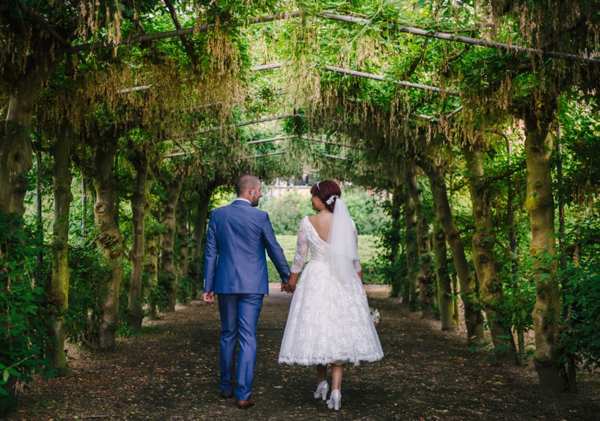 A couple on the wedding day in the gardens of Temple Newsam