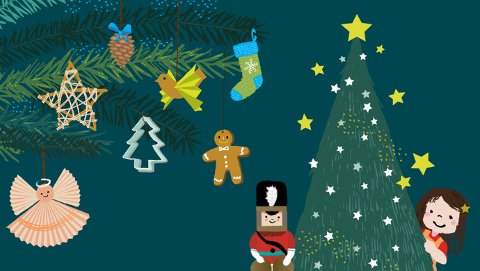 Christmas baubles like gingerbreadmen, paper angels and stocking hanging from branches