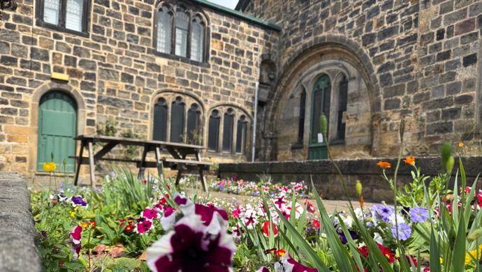 A flower bed in front of Abbey House Museum