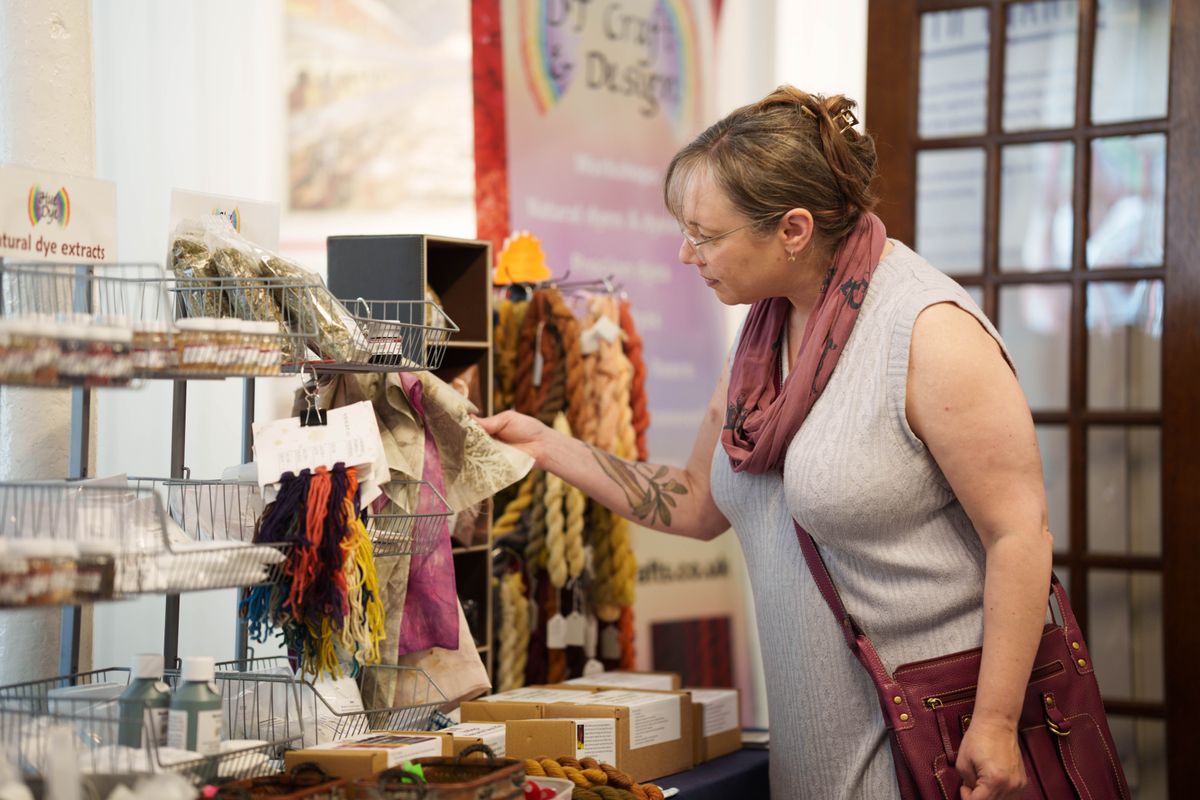 A person looking at a market stall
