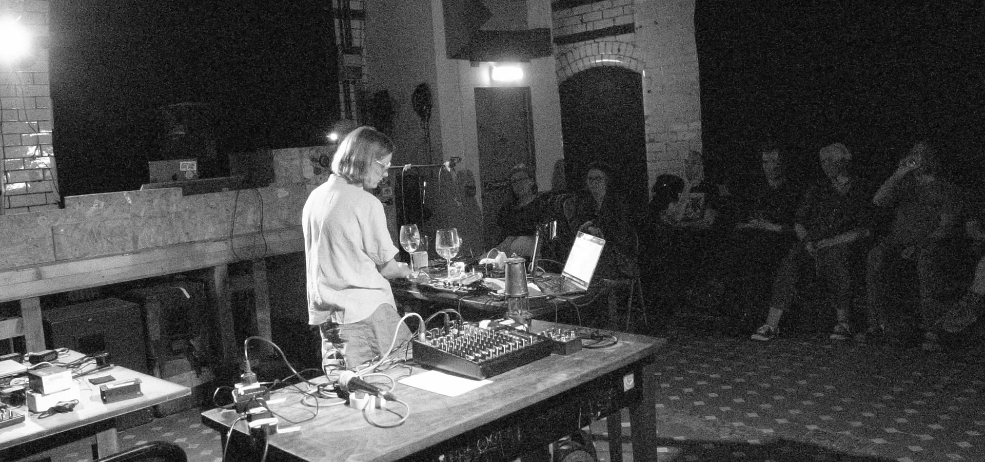 Mia Windsor using found objects as musical instruments.