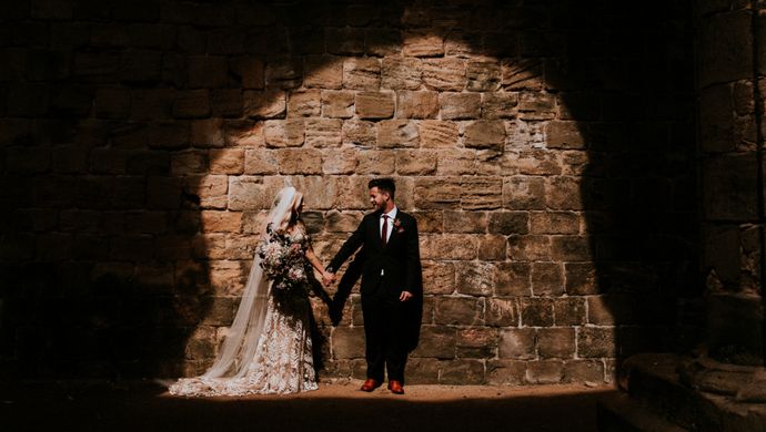 A wedding couple at Kirkstall Abbey
