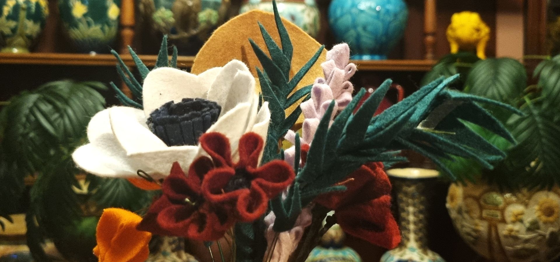 A bouquet of felt flowers in a replica ceramics shop in Abbey House Museum