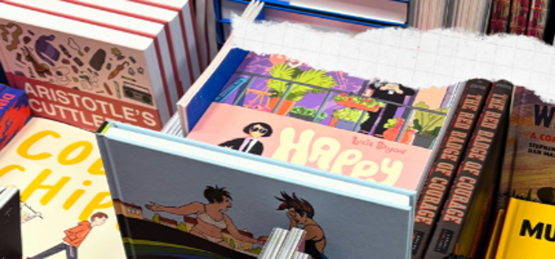 piles of hard back comics