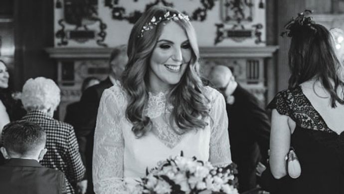 A bride holding a bouquet at Temple Newsam