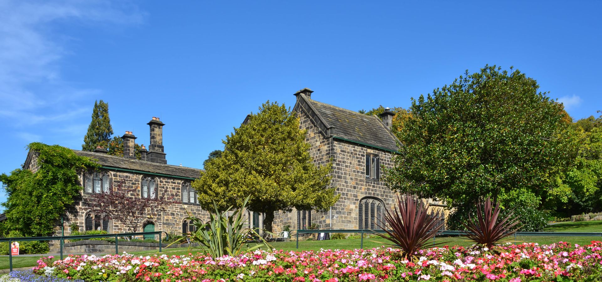 A flower bed in front of Abbey House Museum