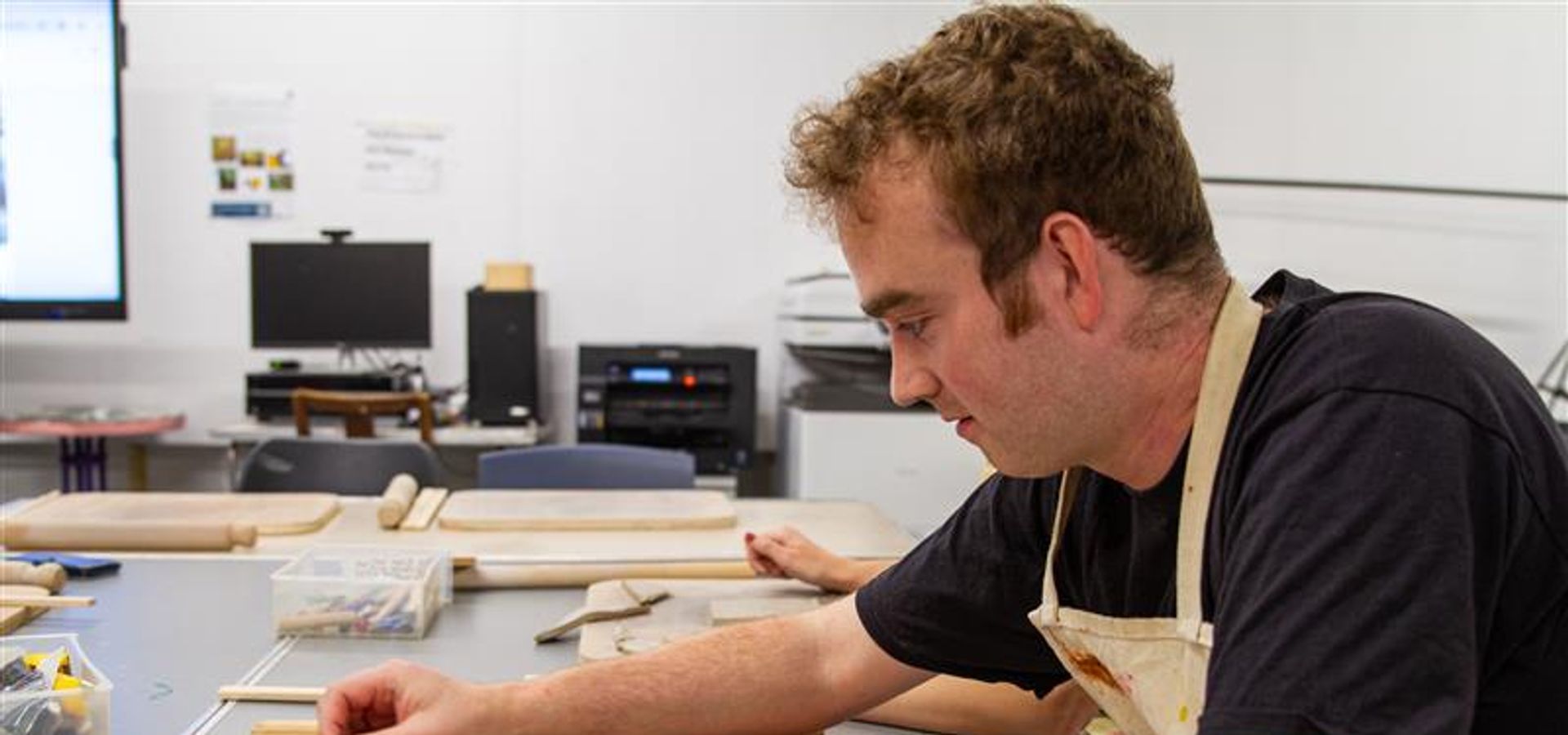 A person working on a clay slab