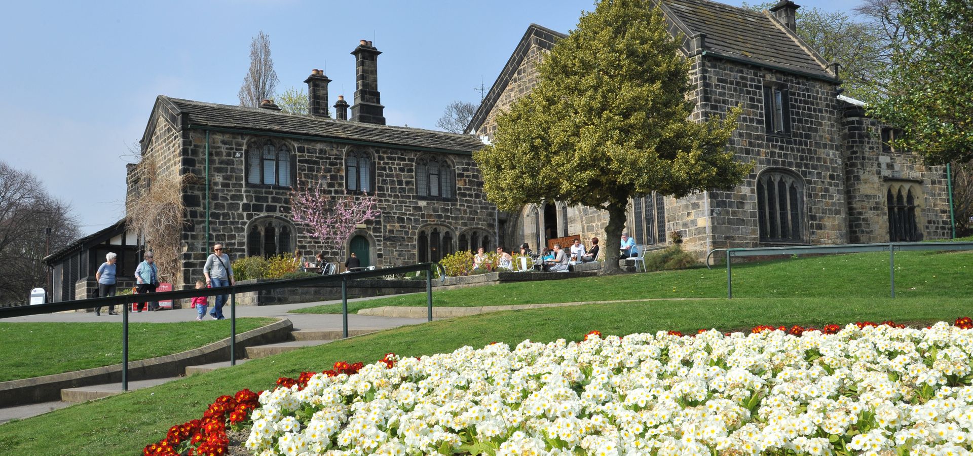 A view of Abbey House Museum across a flower bed