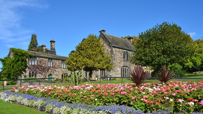 A flower bed in front of Abbey House Museum