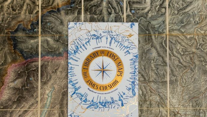 A photograph of the cover of James Cheshire's book, 'The Library of Lost Maps'