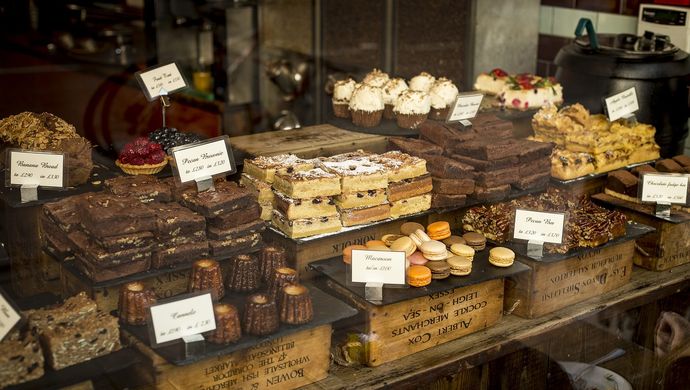 A stall of various baked goods and cakes