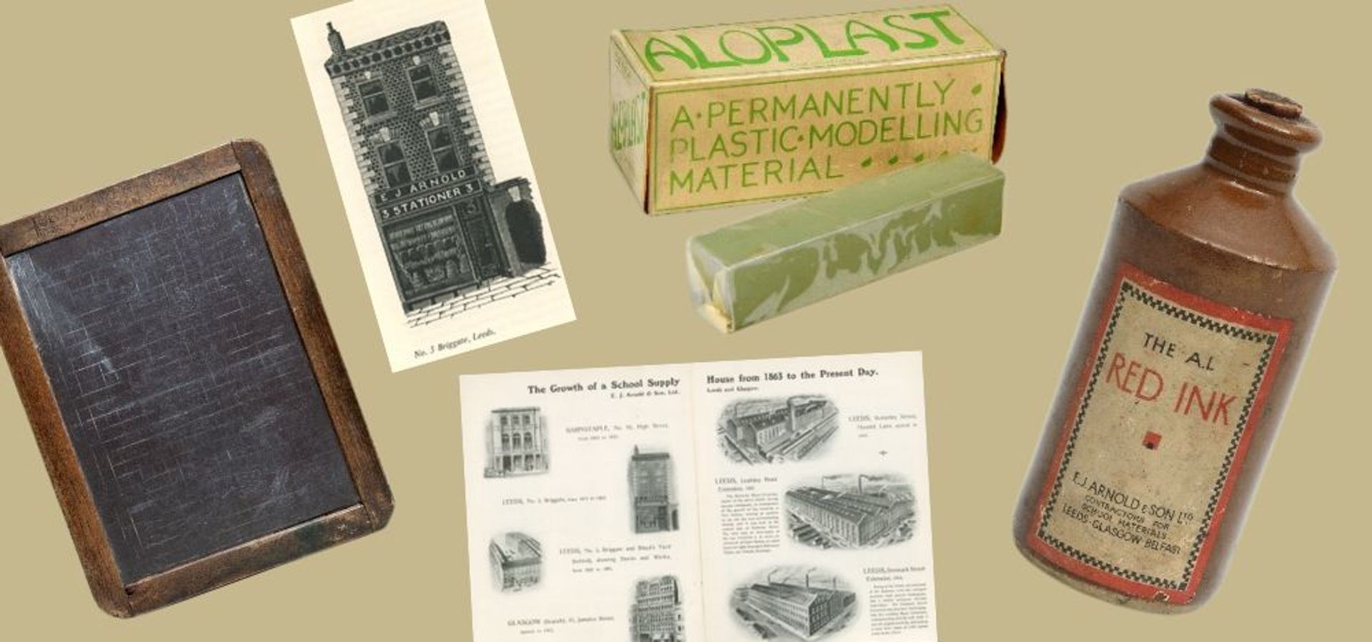 a complication of E J Arnold items like a jar of red ink, a chalkboard, modelling clay