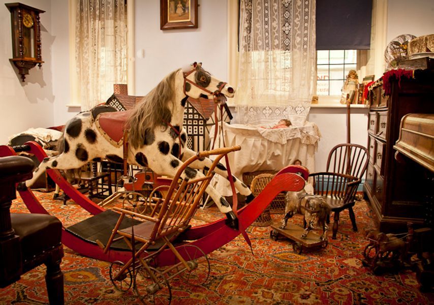 Rocking horse in a room at Abbey House Museum