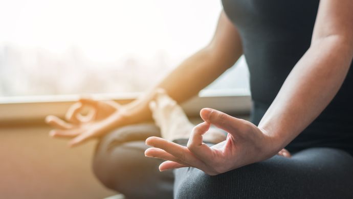 A women in a meditative pose