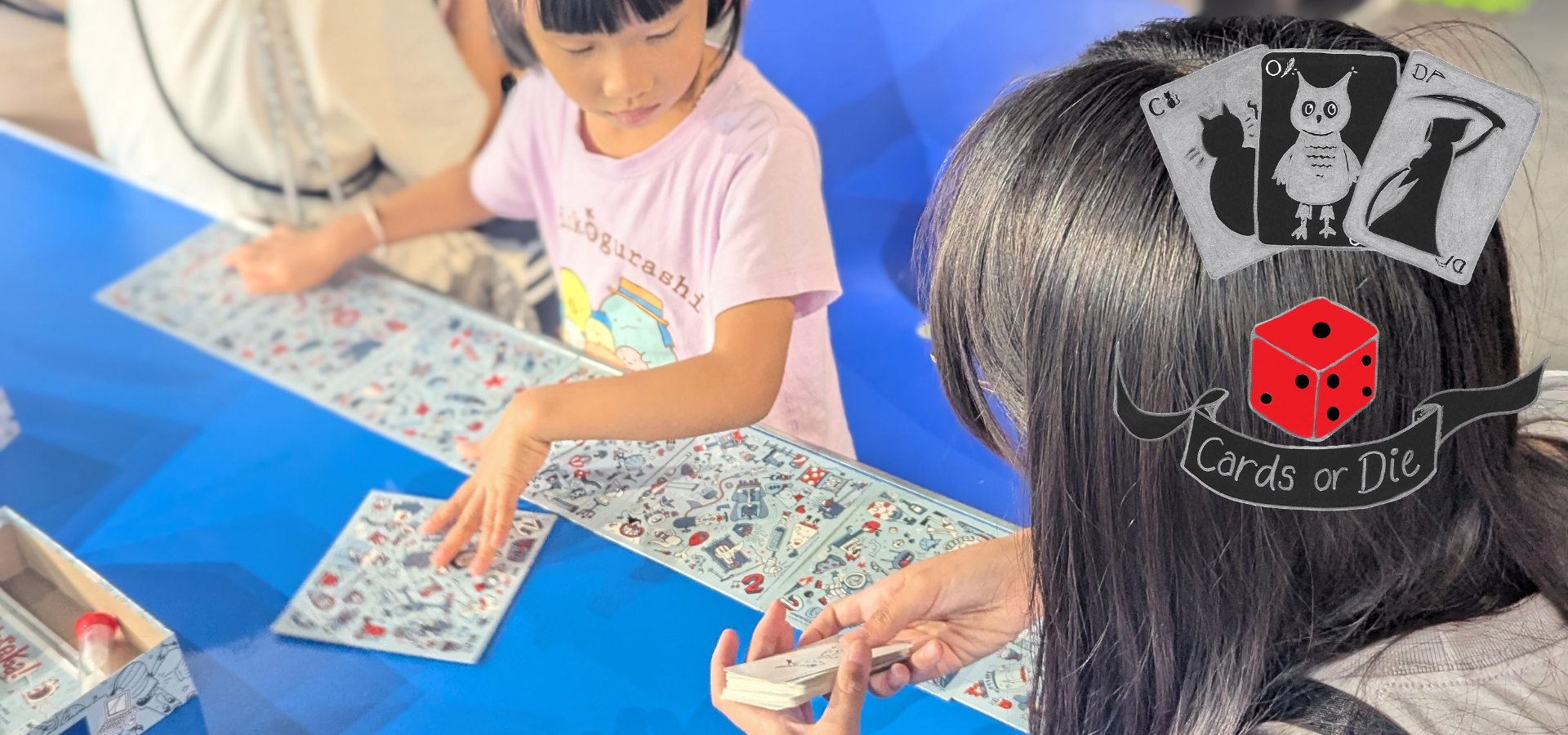Family playing board games with an overlayed Card or Die logo
