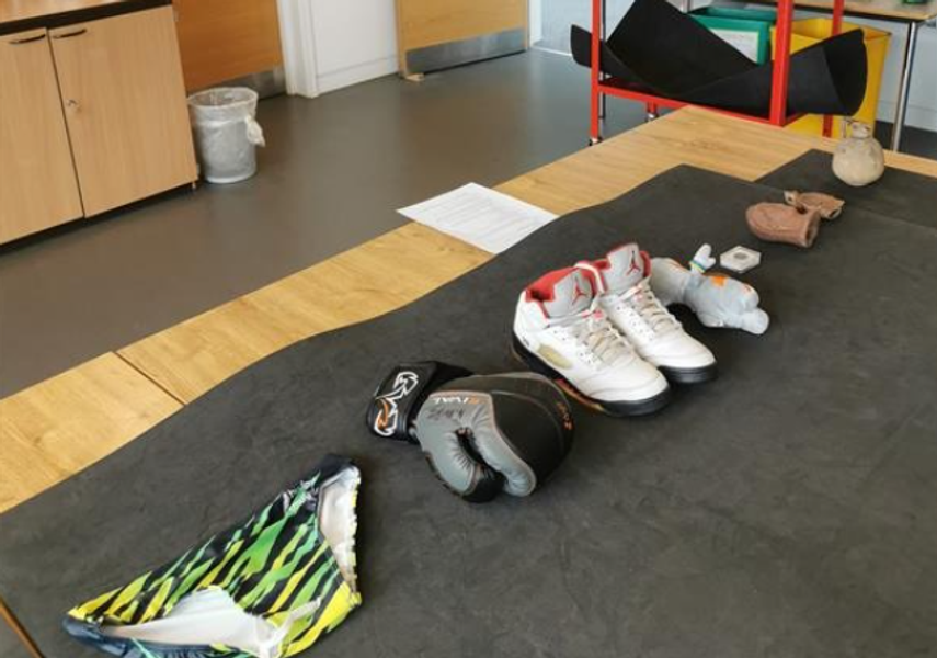 A table in the Education Space with collection object on, in this case, sports shoes