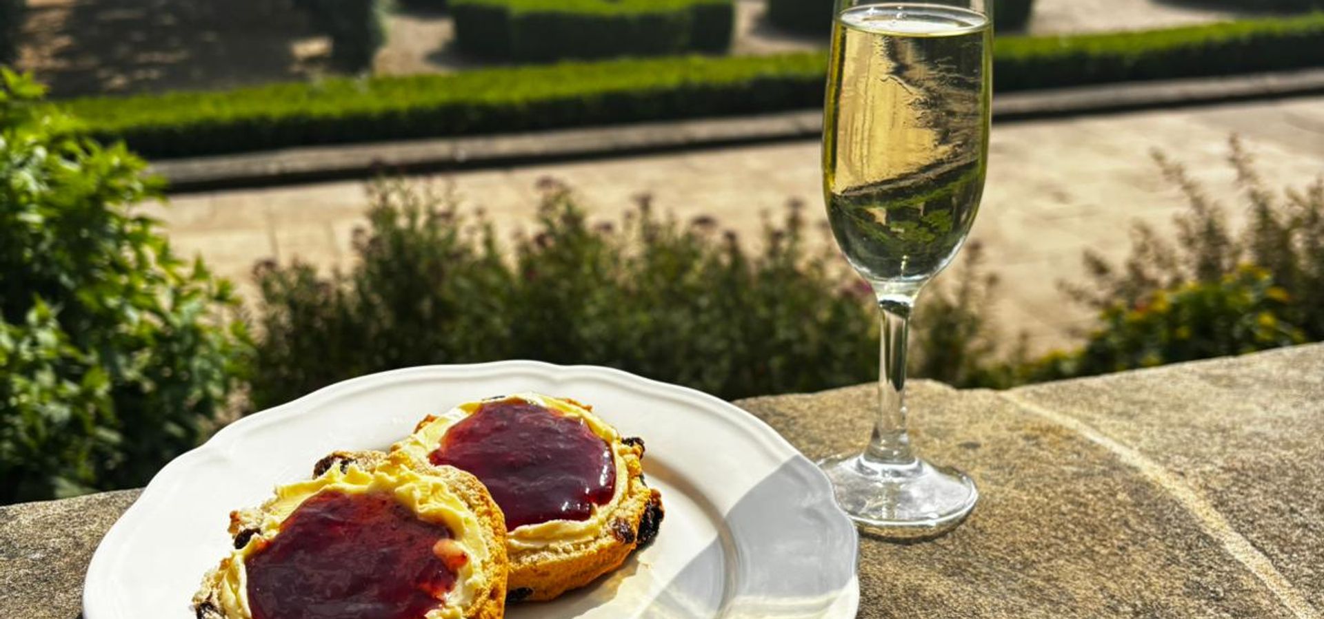 Cream tea and a glass of fizz overlooking the formal gardens from the south terrace of Temple Newsam
