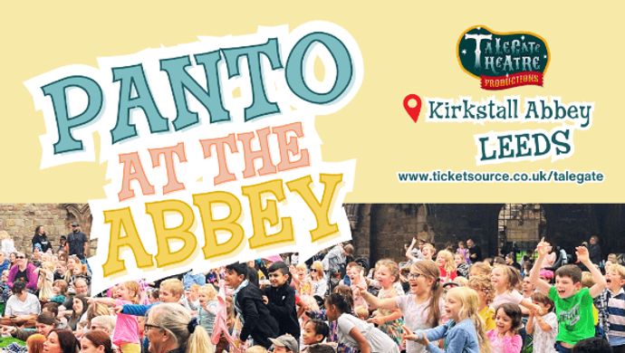 An audience of families with text reading "Panto at the Abbey"