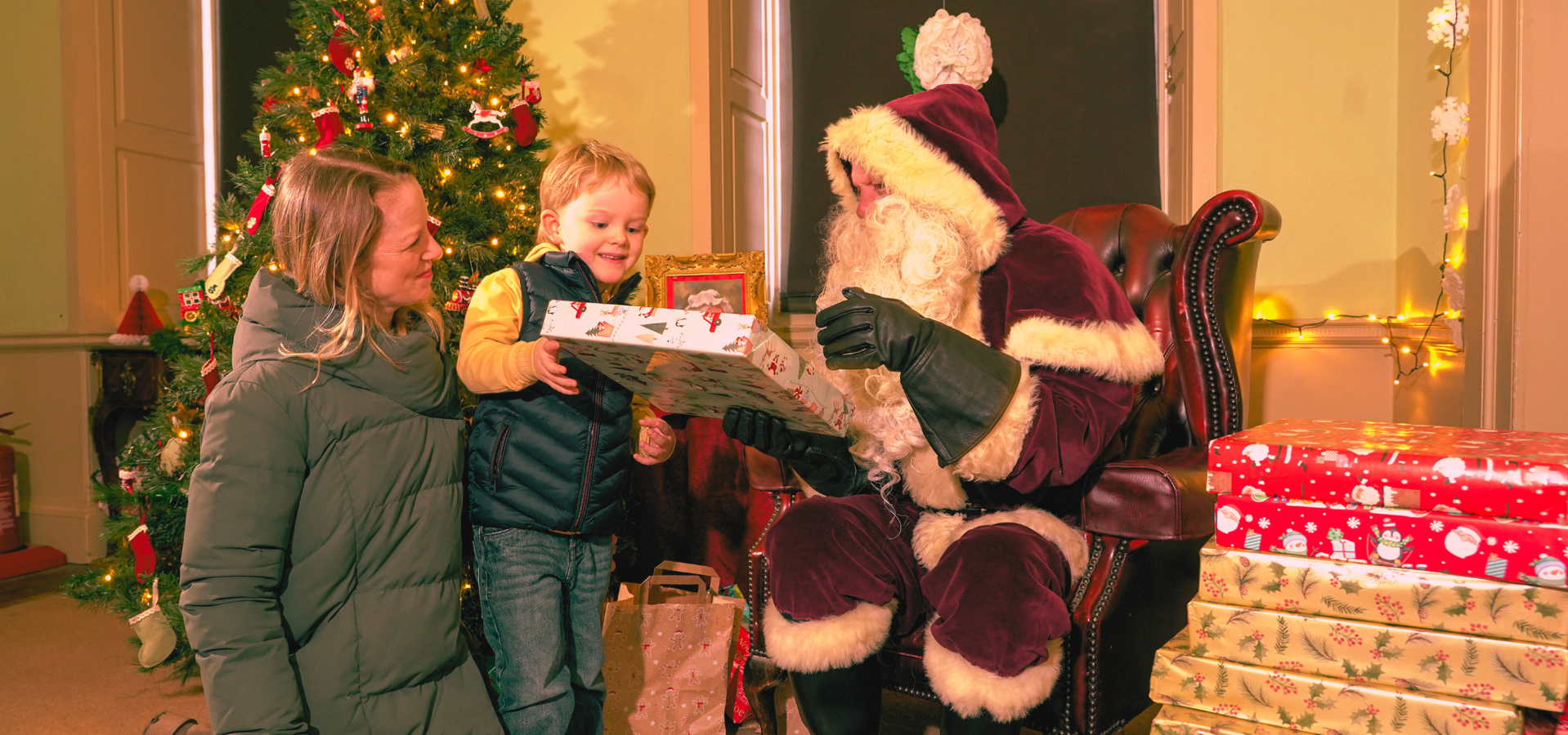A family visiting Father Christmas at Temple Newsam
