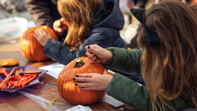 Children carving pumpkins