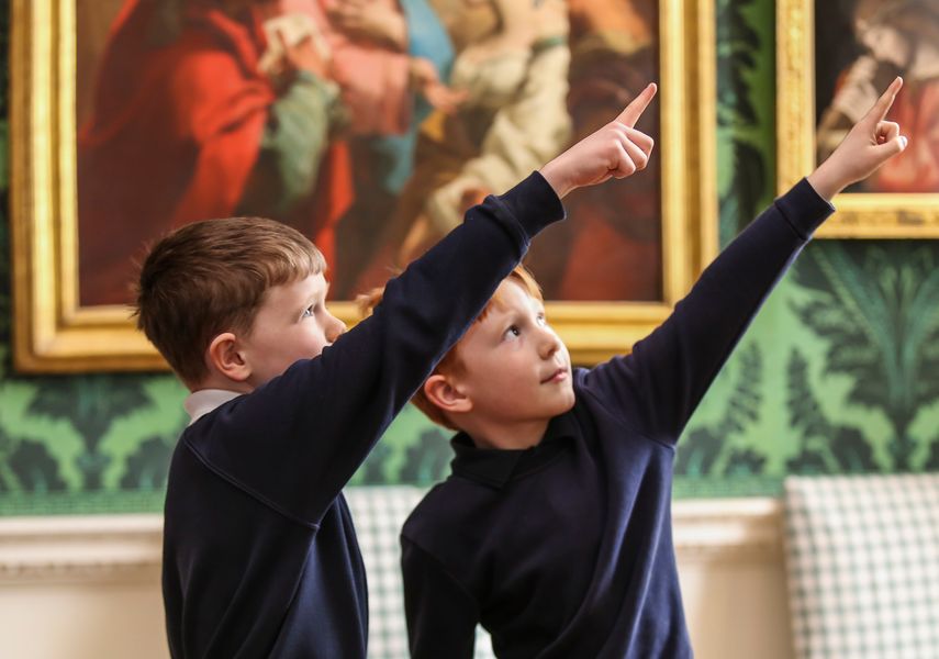 image of two boys pointing at portraits in Temple Newsam House