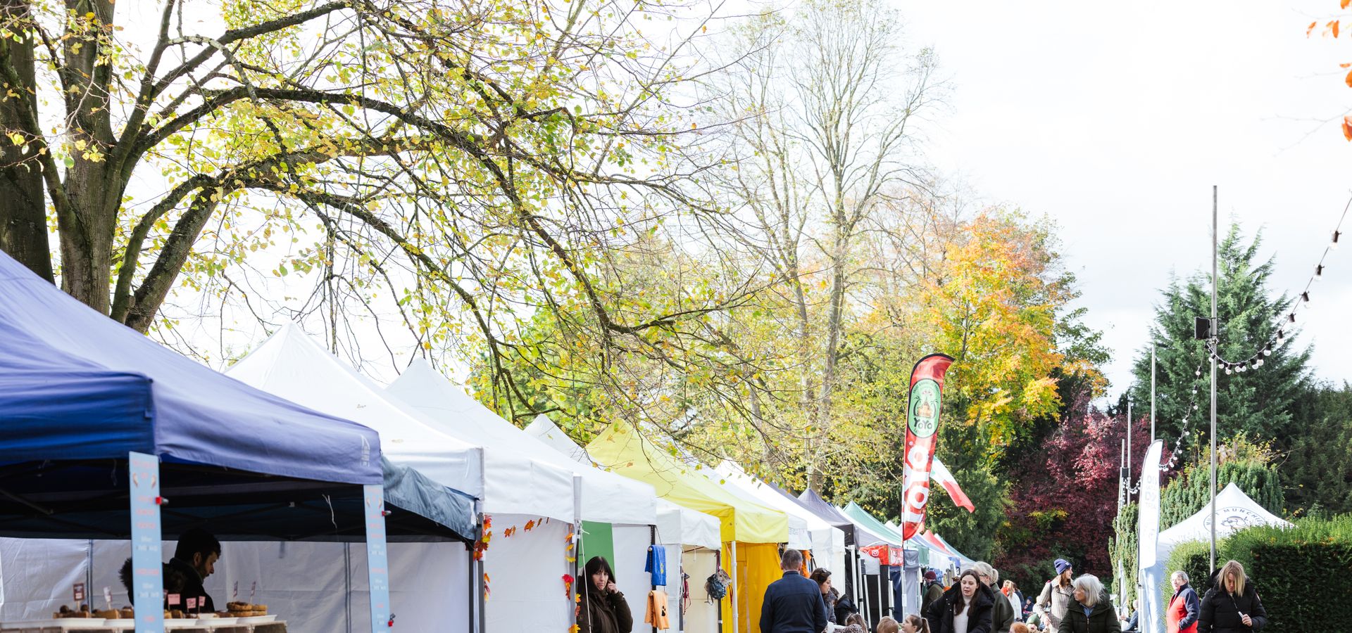 A row of market stalls and tents