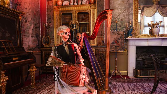 Skeletons playing musical instruments in the historic settling of Temple Newsam House