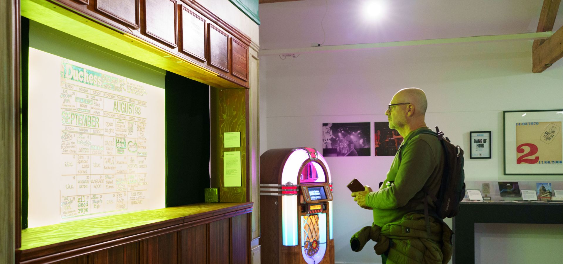 A man looking at replica bar in the Music Leeds Us exhibition