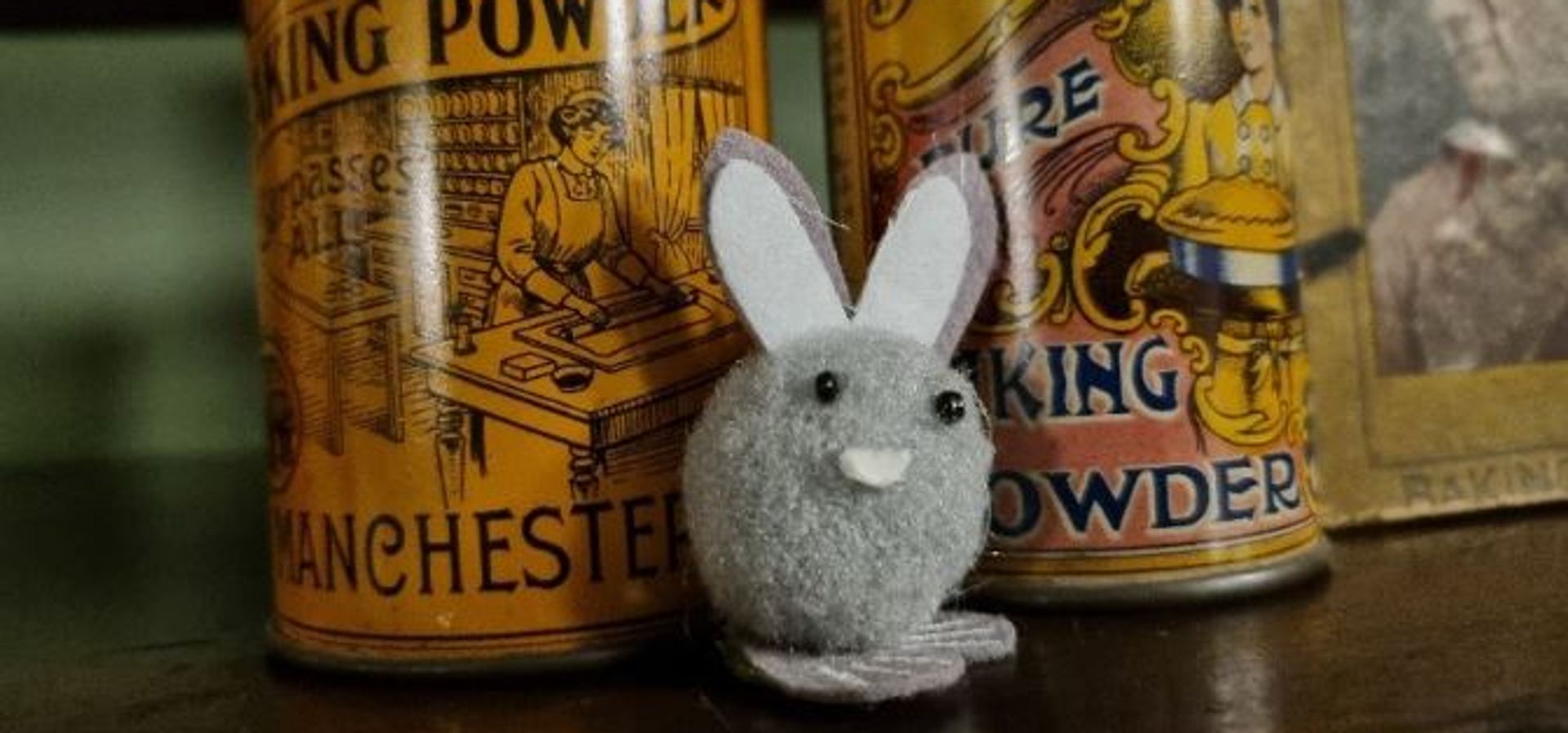 A felt bunny hidden amongst some pots at Abbey House Museum