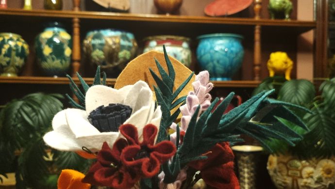 A bouquet of felt flowers in a replica ceramics shop in Abbey House Museum