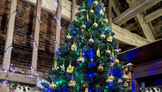 Decorated Christmas tree in a barn