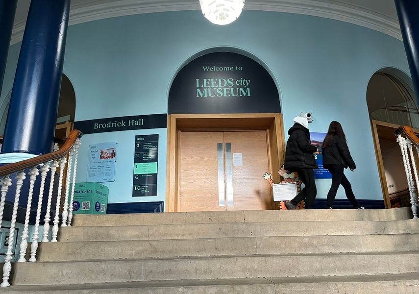 An image of the stairs up to the First Floor with the doors to Brodrick Hall at the top