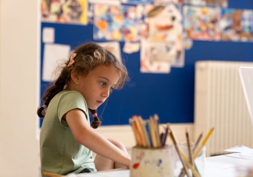 A child using art supplies