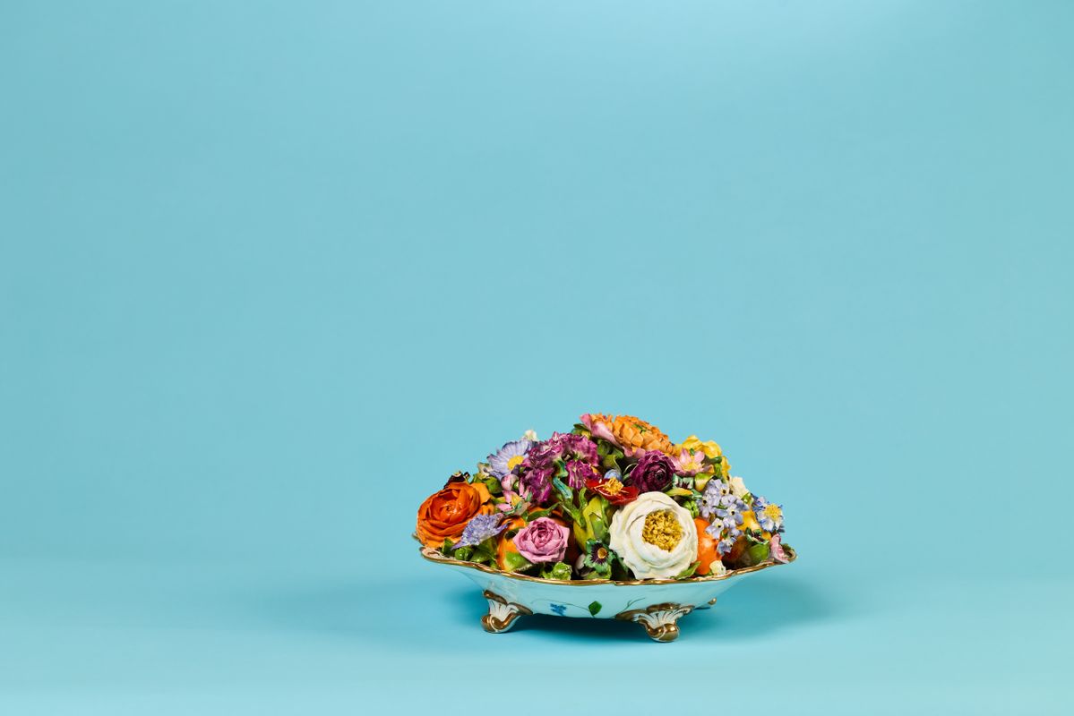 A small dish with 3D colourful flowers on top