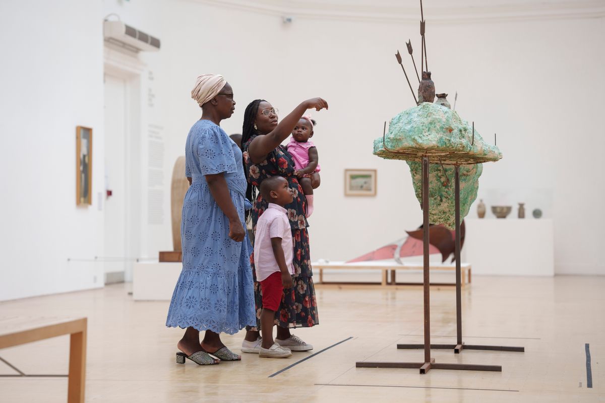 A family enjoying sculpture at Leeds Art Gallery