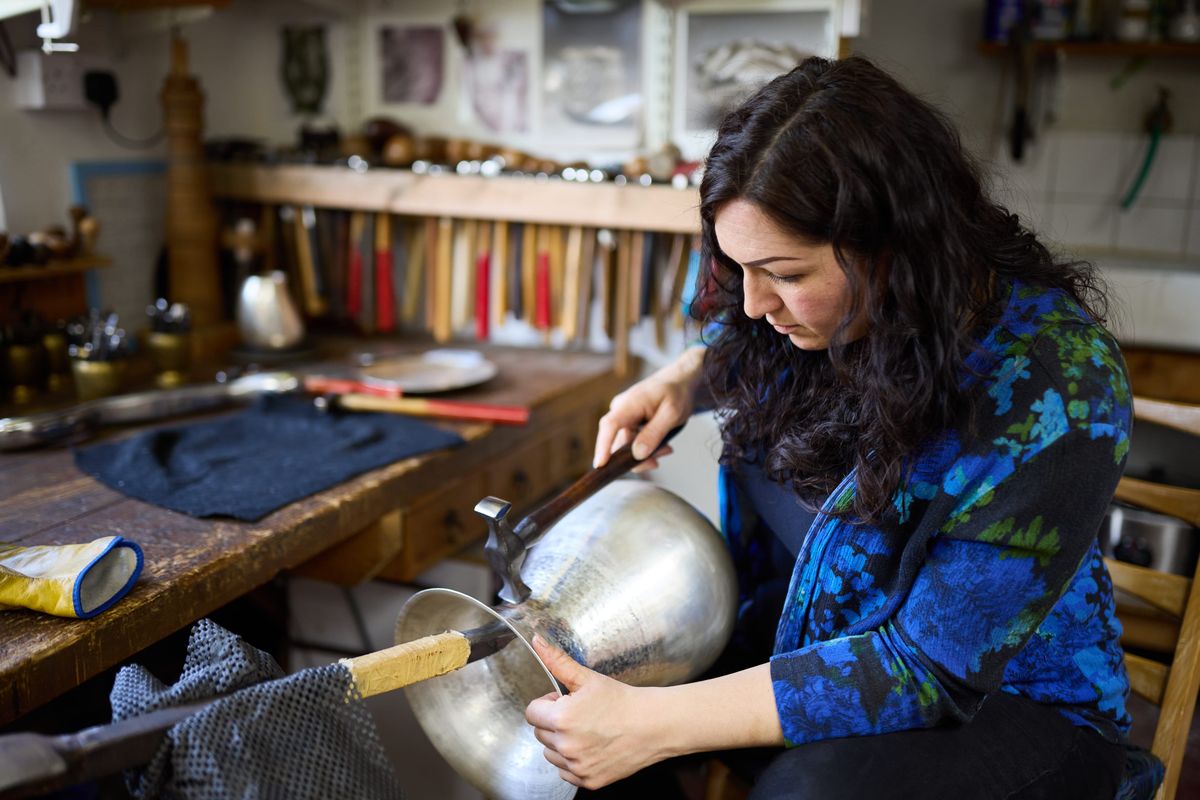 Miriam Handid shaping silver samples in her studio