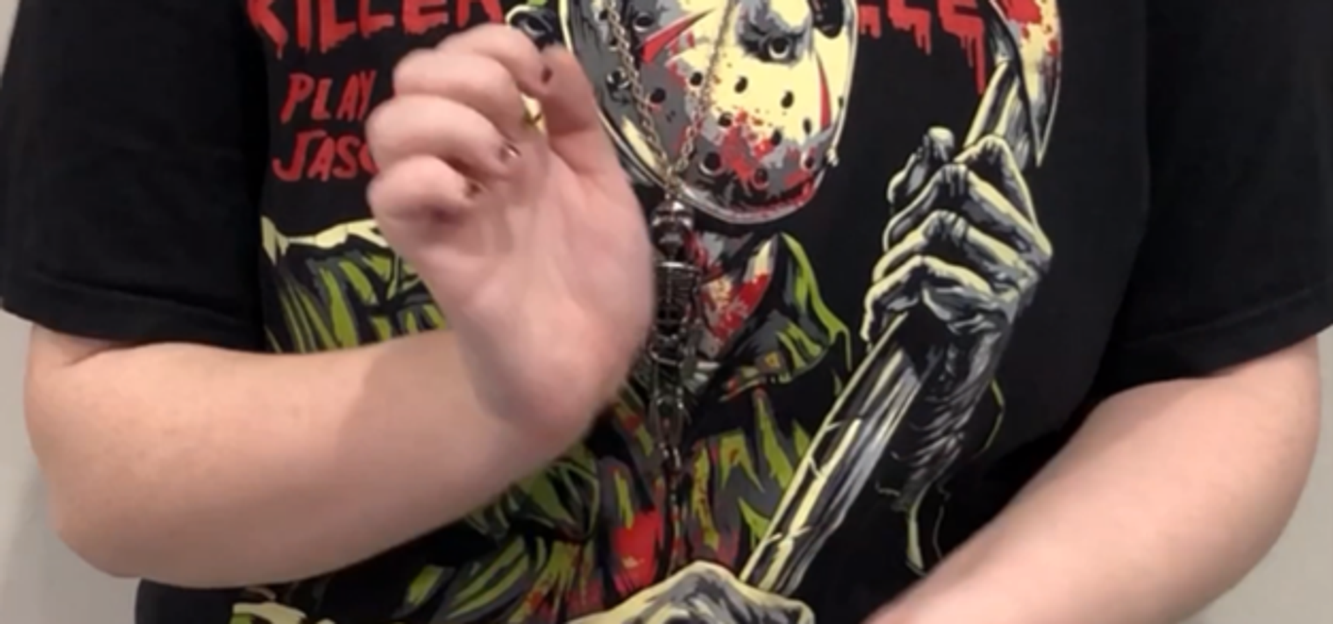 two hands in from of a body, with the person knocking their wrists together