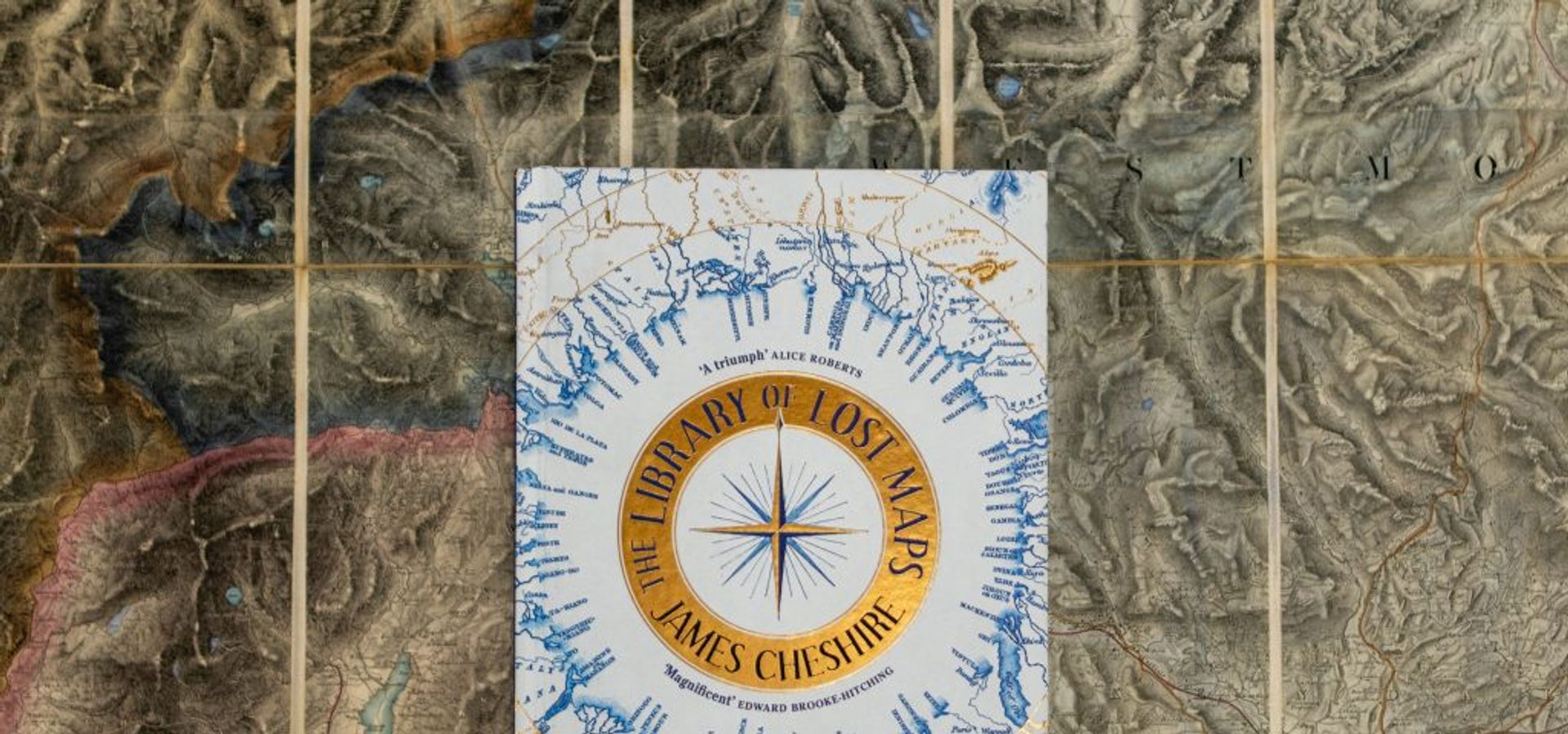 A photograph of the cover of James Cheshire's book, 'The Library of Lost Maps'