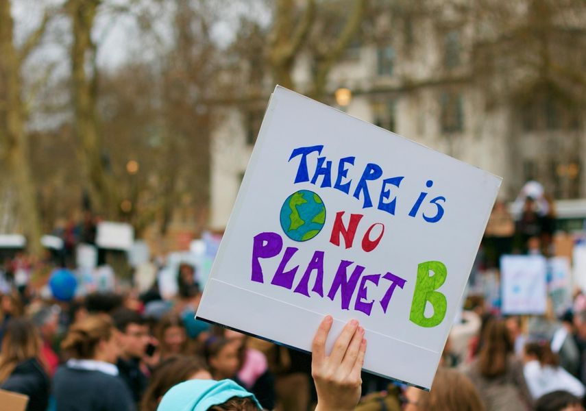 A protester holding up a sign "There is a planet B"