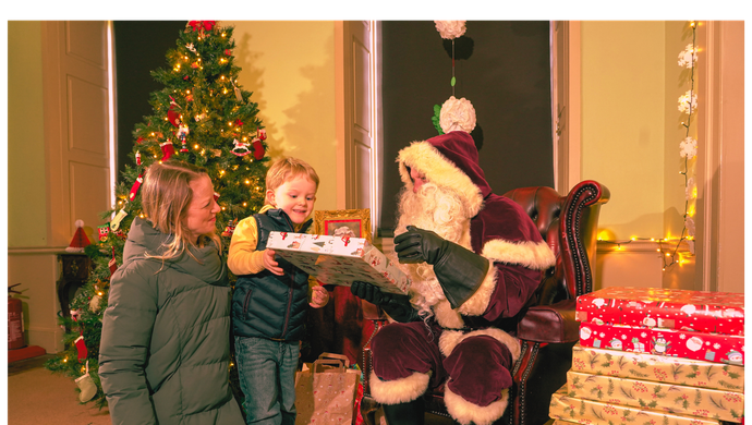 A family visiting Father Christmas at Temple Newsam