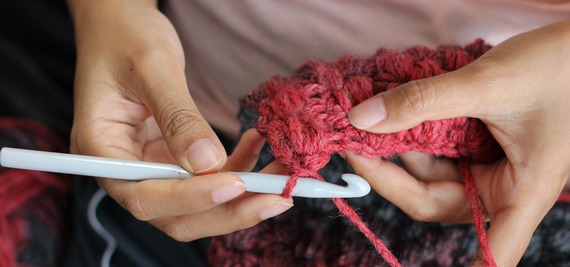 A person crocheting