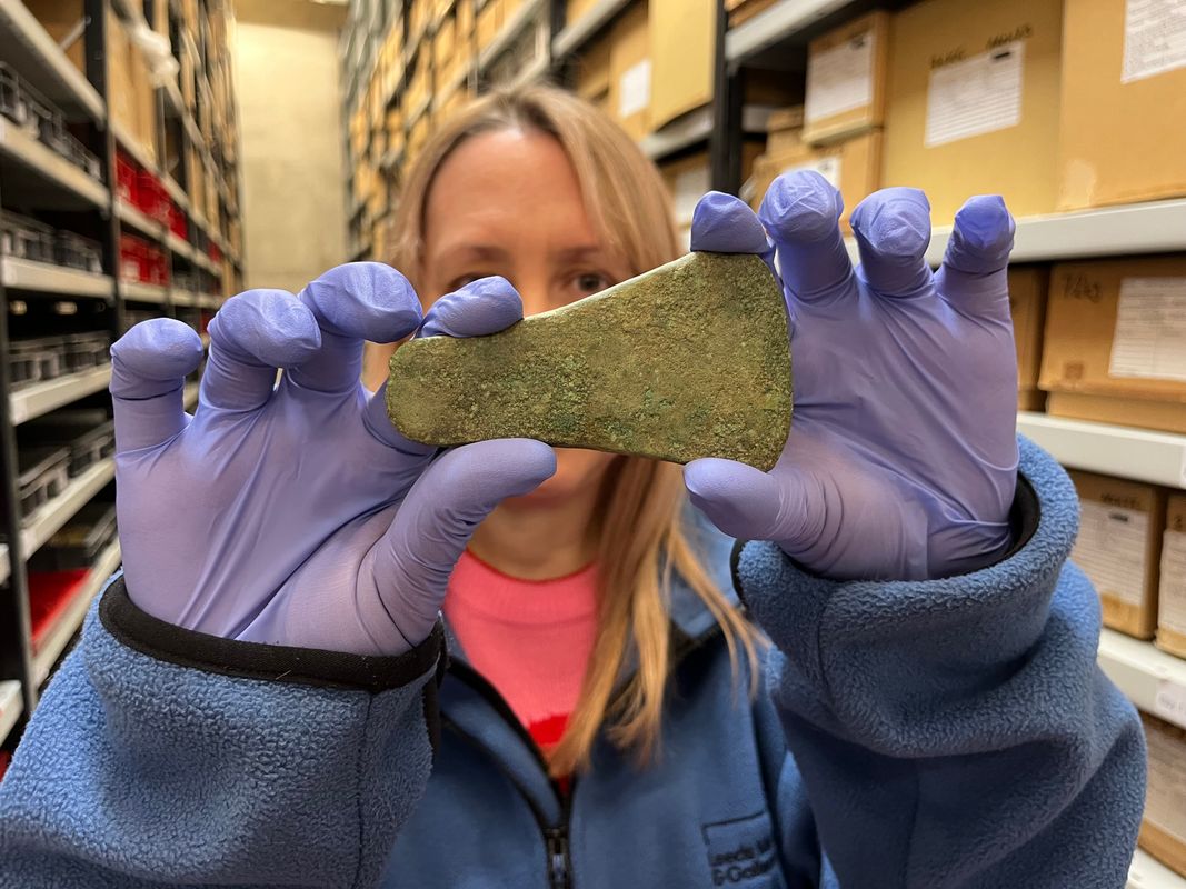 a bronze alloy flat axe head, believed to be more than 4,000 years old. Kat Baxter, Leeds Museums and Galleries' curator of archaeology is shown here with the find.
