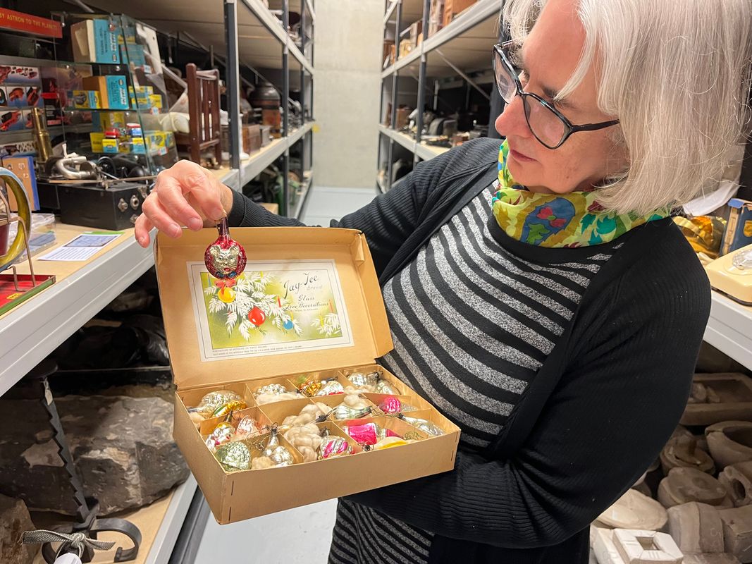 a set of Mickey Mouse Christmas tree lights as well as some brightly coloured glass baubles manufactured by Morley’s Briteglass Ltd