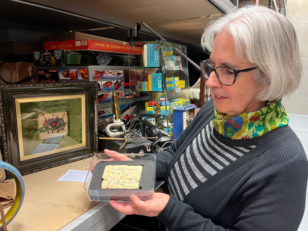 Curator Kitty Ross with Private Maxwell's festive message at Leeds Discovery Centre.