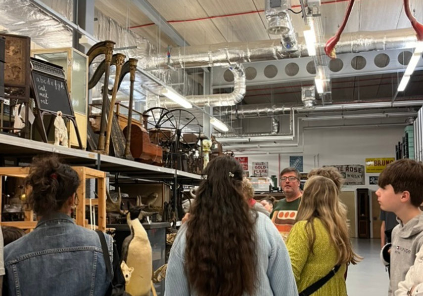 A group of people having a tour in Leeds Discovery Centre Store room