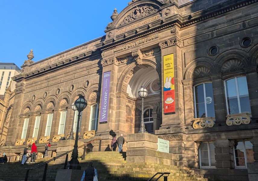 The front of the Leeds City Museum, with stairs up and a ramp to the left